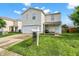 Inviting two-story home showcasing a well-kept lawn and a welcoming front porch seating area at 7906 States Bend Ln, Indianapolis, IN 46239