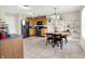 Spacious kitchen featuring dark appliances, wooden cabinetry, and a cozy dining area with ample seating at 7906 States Bend Ln, Indianapolis, IN 46239