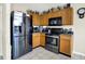 The well-lit kitchen is equipped with stainless steel appliances and ample cabinet space for storage and convenience at 7906 States Bend Ln, Indianapolis, IN 46239