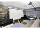 Finished basement area designed as a media room with screen at 7906 States Bend Ln, Indianapolis, IN 46239