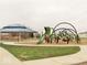 Community playground area featuring a unique climbing structure and shaded gazebo at 7906 States Bend Ln, Indianapolis, IN 46239