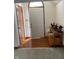 Inviting foyer with a wood floor, complemented by a decorative table with eagle statue at 806 S Jefferson St, Brownsburg, IN 46112