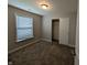 Comfortable bedroom featuring carpet, a bright window, and a convenient closet at 8415 Fieldfare Way, Indianapolis, IN 46237