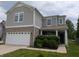 Charming two-story home featuring a two-car garage, brick accents, and a covered front porch at 8415 Fieldfare Way, Indianapolis, IN 46237
