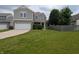 Charming two-story home featuring a two-car garage, brick accents, and a well-maintained lawn at 8415 Fieldfare Way, Indianapolis, IN 46237