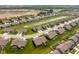 A pond and neatly arranged homes highlight this neighborhood, showcasing tranquil living in a Gathering-friendly community at 8842 Twain Ln, Indianapolis, IN 46239