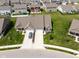 A charming single-Gathering home boasts an attached two-car garage, pristine landscaping, and a manicured lawn at 8842 Twain Ln, Indianapolis, IN 46239