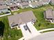 This single-Gathering home features a lush lawn, tidy landscaping, and an attached two-car garage at 8842 Twain Ln, Indianapolis, IN 46239