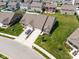 Single-Gathering home with a two-car garage, complemented by lush green lawns and decorative landscaping at 8842 Twain Ln, Indianapolis, IN 46239