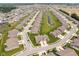 Lush neighborhood aerial view showcases a long pond and manicured lawns adding to the community's appeal at 8842 Twain Ln, Indianapolis, IN 46239