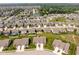 This aerial view displays a well-planned residential area with tree-lined streets, homes, and green spaces at 8842 Twain Ln, Indianapolis, IN 46239