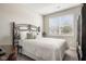 Bedroom featuring a bed, side table, dresser, and a window at 8842 Twain Ln, Indianapolis, IN 46239