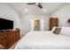 This bedroom has carpet and features a wooden dresser and a doorway to the bathroom at 8842 Twain Ln, Indianapolis, IN 46239