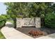 Stone community sign for Village of New Bethel with manicured landscaping at 8842 Twain Ln, Indianapolis, IN 46239