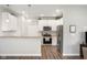 Modern kitchen featuring white cabinets, stainless steel appliances, and a breakfast bar at 8842 Twain Ln, Indianapolis, IN 46239