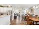 Open-concept layout featuring a modern kitchen, dining area, and living space with ample natural light at 8842 Twain Ln, Indianapolis, IN 46239