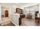 Home office with hardwood floors, display cabinet, and a view to the main bedroom at 8842 Twain Ln, Indianapolis, IN 46239
