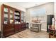 The office features a display cabinet, hardwood floors, and a window at 8842 Twain Ln, Indianapolis, IN 46239