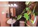 Bathroom features modern vanity lighting, unique black honeycomb accent wall, and a pedestal sink at 972 N Audubon Rd, Indianapolis, IN 46219