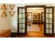 Dining room with decorative lighting seen through open doors to living room at 972 N Audubon Rd, Indianapolis, IN 46219