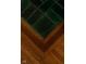 Detailed flooring of unique tile and hardwood craftsmanship with chevron pattern at 972 N Audubon Rd, Indianapolis, IN 46219
