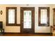Foyer featuring decorative windows, hardwood floors, and a welcoming entrance at 972 N Audubon Rd, Indianapolis, IN 46219