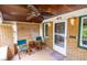 Cozy front porch with a ceiling fan, seating, and a welcoming entrance at 972 N Audubon Rd, Indianapolis, IN 46219