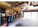 Spacious garage featuring a variety of storage solutions, tools, and ample open floor space at 972 N Audubon Rd, Indianapolis, IN 46219