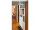 Inviting hallway with hardwood floors, stylish decor and access to multiple rooms at 972 N Audubon Rd, Indianapolis, IN 46219