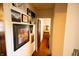 Charming hallway features wood floors, stylish decor and access to a bright bedroom at 972 N Audubon Rd, Indianapolis, IN 46219
