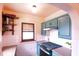 Kitchen featuring painted cabinets, stainless steel range, and bright countertops at 972 N Audubon Rd, Indianapolis, IN 46219