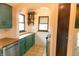 Bright kitchen boasts painted cabinets, plenty of countertop space and lots of storage at 972 N Audubon Rd, Indianapolis, IN 46219