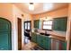 Lovely traditional kitchen features stainless steel appliances, dark countertops and painted cabinets at 972 N Audubon Rd, Indianapolis, IN 46219