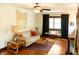 Cozy living room with wood floors, natural light, ceiling fan, and stylish furniture at 972 N Audubon Rd, Indianapolis, IN 46219