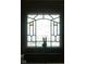 Close-up view of an interior window with a unique stained glass design at 972 N Audubon Rd, Indianapolis, IN 46219