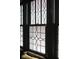 Close up of elegant windows with intricate, decorative window panes and dark trim at 972 N Audubon Rd, Indianapolis, IN 46219