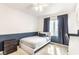 Bedroom featuring natural light, contemporary bedframe, with navy accents at 9740 Logan Ln, Fishers, IN 46037
