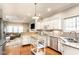 Modern kitchen with stainless steel appliances, granite countertops, white cabinets, and an open layout at 9740 Logan Ln, Fishers, IN 46037