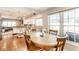 Cozy breakfast nook with a wooden table and white kitchen featuring modern appliances and granite countertops at 9740 Logan Ln, Fishers, IN 46037