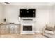 Inviting living room featuring a fireplace, stylish cabinet, and comfortable seating at 9740 Logan Ln, Fishers, IN 46037