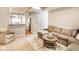 Spacious living room with a sectional sofa, decorative rug, and open layout to the kitchen at 9740 Logan Ln, Fishers, IN 46037