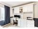 Office space featuring custom built-in shelving, drawers, and ample desk space at 9740 Logan Ln, Fishers, IN 46037