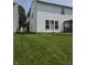 A shot of a home's backyard and siding and a view of the patio at 10523 Dark Star Dr, Indianapolis, IN 46234