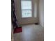Bathroom with white window and a long silver mirror at 10523 Dark Star Dr, Indianapolis, IN 46234