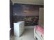 Bedroom with lavender walls and a white dresser, complemented by a mural of the city at 10523 Dark Star Dr, Indianapolis, IN 46234
