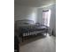 Bedroom featuring white walls, carpet flooring, and a black metal bedframe at 10523 Dark Star Dr, Indianapolis, IN 46234