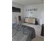 Bedroom with white walls, a light wood dresser, carpet flooring and a moon wall decoration at 10523 Dark Star Dr, Indianapolis, IN 46234