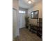 Inviting foyer with tile flooring, a console table, and a view of the front door at 10523 Dark Star Dr, Indianapolis, IN 46234