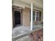 Close-up of the home's front porch, showcasing brick details and a covered entrance at 10523 Dark Star Dr, Indianapolis, IN 46234