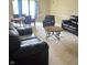 Bright living room featuring comfortable leather seating, a dining table, and natural light at 10523 Dark Star Dr, Indianapolis, IN 46234